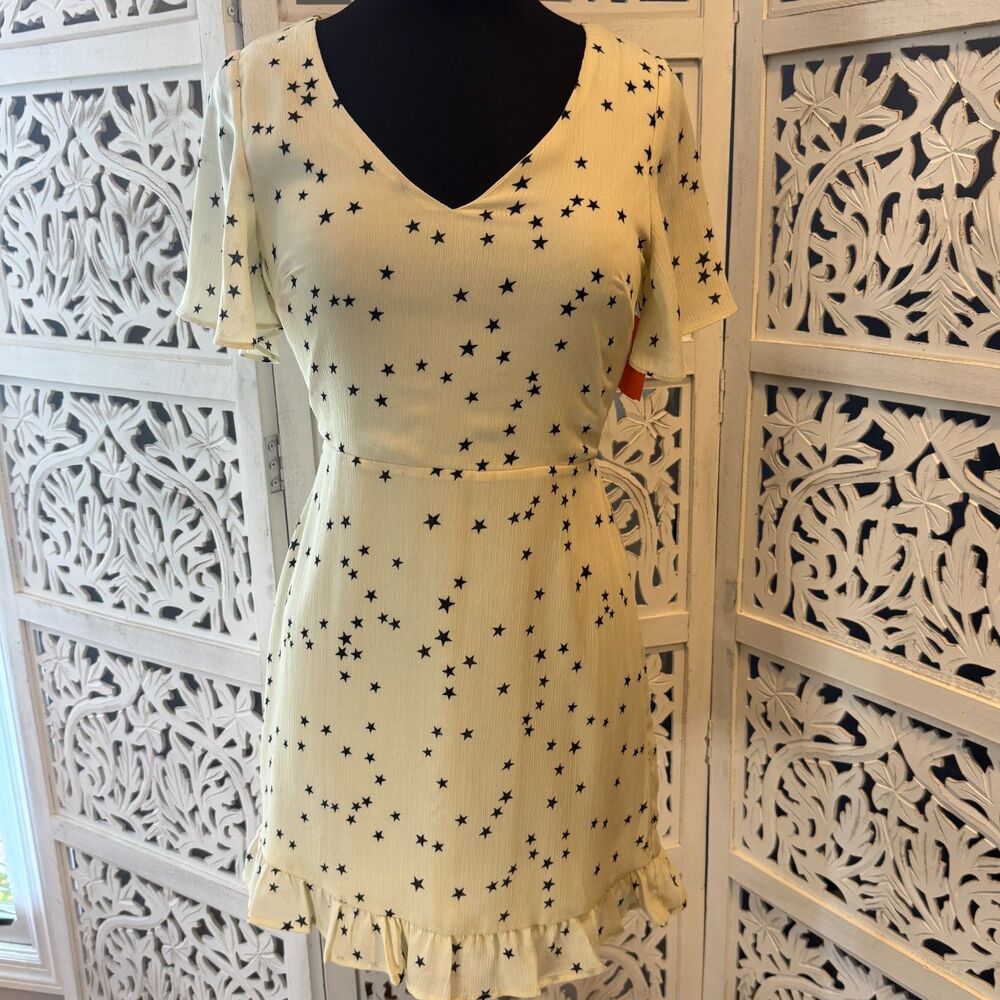 Cream Colored Dress with Black Stars Size Medium V neck
